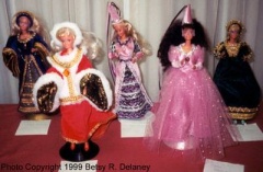 CC17-DC-11-15: 11. Tudor Barbie (far left). 12. Medieval Barbie (middle left). 13. Rainbow Barbie (center). 14. Pretty in Pink Barbie (middle right). 15. Italian Renaissance Barbie (far right)